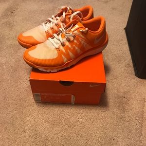 Size 9 in women’s Nike Tennessee Free Runs